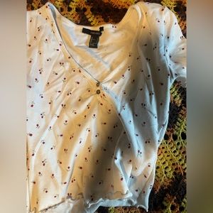 Cropped a white shirt with red roses on it